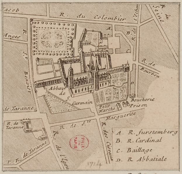 Ein alter Stadtplan mit einem zentralen Gebäude und beschreibendem Text auf dem Papier.