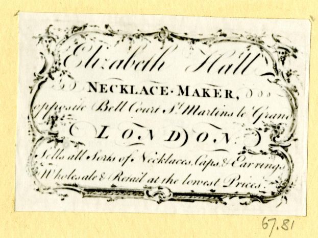 Eine alte Visitenkarte mit einem Bild eines Schmuckherstellers und einem Text über dessen Dienstleistungen.