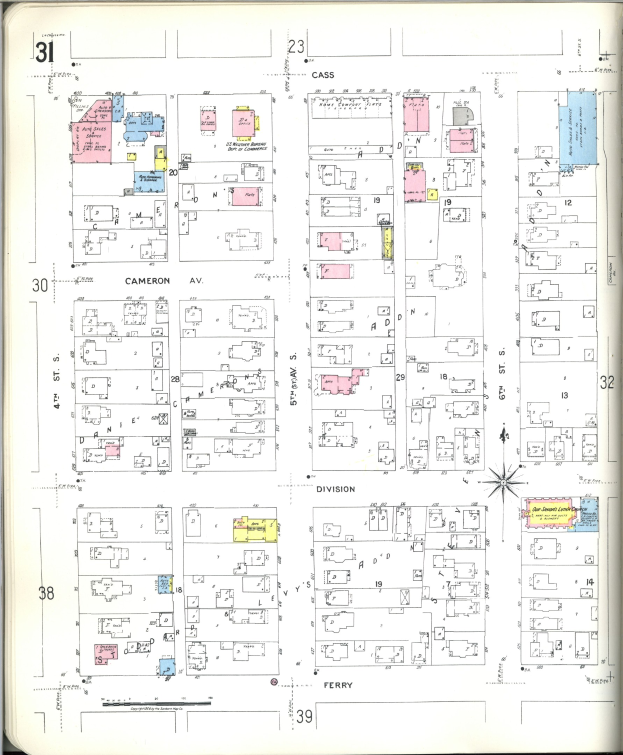 Altes Buch mit einer Stadtkarte aus den 1920er Jahren auf dem Cover, das Gebäudepläne, Straßen, Parks und Sehenswürdigkeiten zeigt.